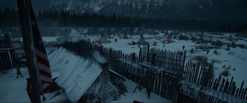 Movie still from “The Revenant” (2015), directed by Alejandro G. Iñárritu – A group of people standing in the middle of a snow covered field; Extreme Wide shot, High angle