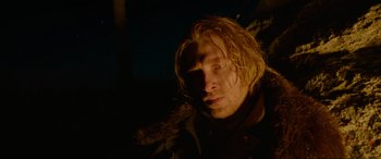 Movie still from “The Revenant” (2015), directed by Alejandro G. Iñárritu – A person with long blonde hair; Close Up shot, Low angle