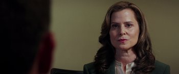 Movie still from “The Ritual Killer” (2023), directed by George Gallo – A person sitting in a chair; Close Up shot, Over the shoulder angle