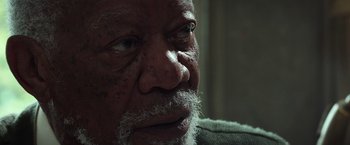 Movie still from “The Ritual Killer” (2023), directed by George Gallo – An older man with a beard and a mustache; Close Up shot, High angle