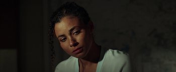 Movie still from “The Ritual Killer” (2023), directed by George Gallo – A person wearing a white shirt; Close Up shot, Low angle