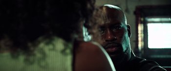 Movie still from “The Ritual Killer” (2023), directed by George Gallo – A person looking at a mirror; Close Up shot, Over the shoulder angle