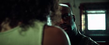 Movie still from “The Ritual Killer” (2023), directed by George Gallo – A person with a beard; Close Up shot, Over the shoulder angle