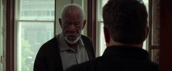 Movie still from “The Ritual Killer” (2023), directed by George Gallo – An older man looking at himself in the mirror; Close Up shot, Over the shoulder angle