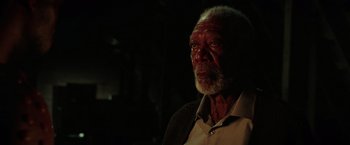 Movie still from “The Ritual Killer” (2023), directed by George Gallo – An older man is looking at the camera; Close Up shot, Low angle