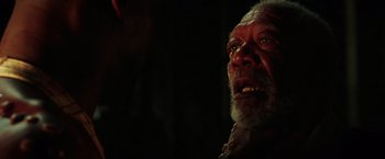 Movie still from “The Ritual Killer” (2023), directed by George Gallo – An old man with a beard is looking angry; Close Up shot, Over the shoulder angle