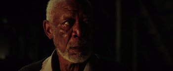 Movie still from “The Ritual Killer” (2023), directed by George Gallo – An old man with a beard is looking at the camera; Close Up shot, Low angle