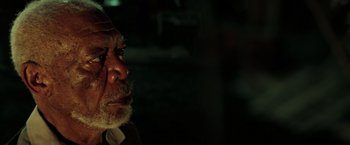 Movie still from “The Ritual Killer” (2023), directed by George Gallo – An old man with a beard is looking into the distance; Close Up shot, High angle