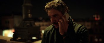 Movie still from “The Ritual Killer” (2023), directed by George Gallo – A person talking on a cell phone; Close Up shot, Low angle
