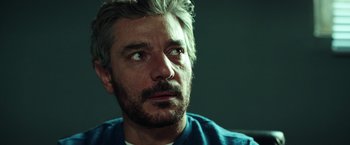 Movie still from “The Ritual Killer” (2023), directed by George Gallo – A person with a beard; Close Up shot, Low angle