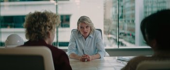Movie still from “The Royal Hotel” (2023), directed by Kitty Green – A woman sitting at a table in front of another woman; Medium shot, Over the shoulder angle