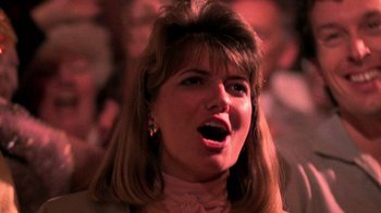 Movie still from “The Running Man” (1987), directed by Paul Michael Glaser – A person with her mouth wide open; Close Up shot, Low angle