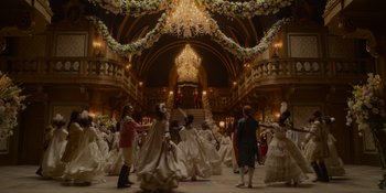 Movie still from “The School for Good and Evil” (2022), directed by Paul Feig – A large group of people in a large ballroom; Extreme Wide shot, Low angle