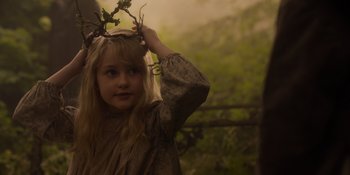 Movie still from “The School for Good and Evil” (2022), directed by Paul Feig – A young girl wearing a crown of leaves on top of her head; Close Up shot, Over the shoulder angle