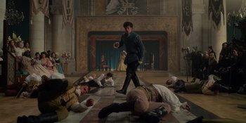 Movie still from “The School for Good and Evil” (2022), directed by Paul Feig – A group of people laying on the floor of a room; Wide shot, High angle