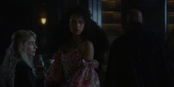 Movie still from “The School for Good and Evil” (2022), directed by Paul Feig – A woman in a pink dress with long black hair; Medium shot, Over the shoulder angle