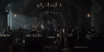 Movie still from “The School for Good and Evil” (2022), directed by Paul Feig – A group of people sitting around a room; Wide shot, High angle