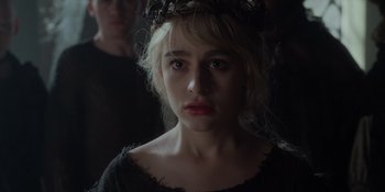 Movie still from “The School for Good and Evil” (2022), directed by Paul Feig – A woman with a crown of flowers on her head looking at the camera; Close Up shot, Over the shoulder angle