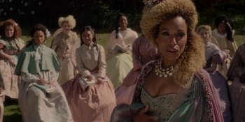 Movie still from “The School for Good and Evil” (2022), directed by Paul Feig – A group of women dressed in period clothing; Close Up shot, Over the shoulder angle
