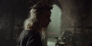 Movie still from “The School for Good and Evil” (2022), directed by Paul Feig – A woman with blonde hair wearing a crown of twigs in her hair; Close Up shot, Over the shoulder angle
