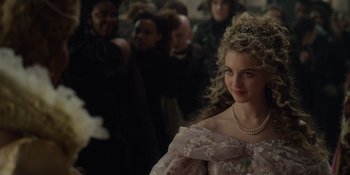 Movie still from “The School for Good and Evil” (2022), directed by Paul Feig – A woman in a pink dress and a tiara; Close Up shot, Over the shoulder angle