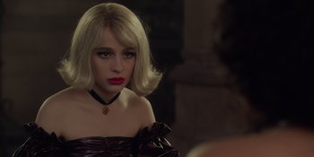 Movie still from “The School for Good and Evil” (2022), directed by Paul Feig – A woman with blonde hair wearing a black dress; Close Up shot, Over the shoulder angle