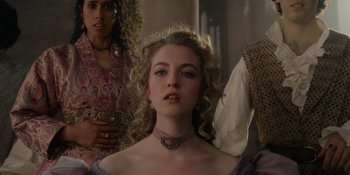 Movie still from “The School for Good and Evil” (2022), directed by Paul Feig – A person wearing a necklace; Close Up shot, Low angle