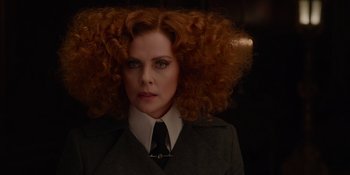 Movie still from “The School for Good and Evil” (2022), directed by Paul Feig – A person wearing a suit and tie; Close Up shot, Low angle