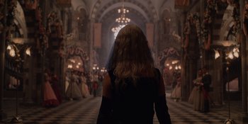 Movie still from “The School for Good and Evil” (2022), directed by Paul Feig – A woman in a black dress and veil in a ballroom; Wide shot, Over the shoulder angle