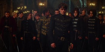 Movie still from “The School for Good and Evil” (2022), directed by Paul Feig – A group of people standing around each other in a room; Medium shot, Over the shoulder angle