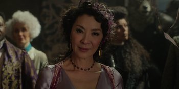 Movie still from “The School for Good and Evil” (2022), directed by Paul Feig – A person wearing a necklace; Close Up shot, Over the shoulder angle