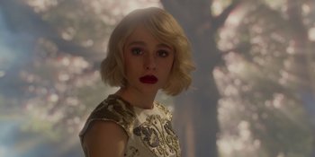 Movie still from “The School for Good and Evil” (2022), directed by Paul Feig – A beautiful young woman with blonde hair and red lipstick; Close Up shot, Over the shoulder angle