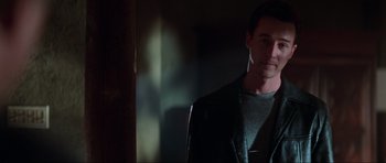 Movie still from “The Score” (2001), directed by Frank Oz – A person wearing a leather jacket; Close Up shot, Low angle