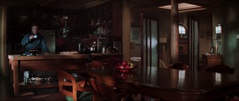 Movie still from “The Score” (2001), directed by Frank Oz – A bowl of fruit sits on a wooden table; Wide shot, High angle