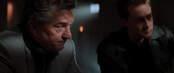 Movie still from “The Score” (2001), directed by Frank Oz – A person sitting down with his eyes closed; Close Up shot, Low angle