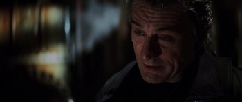 Movie still from “The Score” (2001), directed by Frank Oz – A man's face in the dark; Close Up shot, Low angle