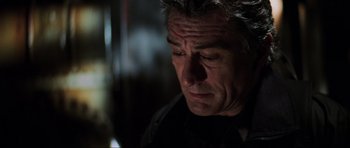 Movie still from “The Score” (2001), directed by Frank Oz – A person looking down; Close Up shot, Low angle