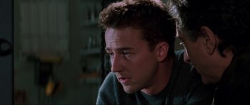 Movie still from “The Score” (2001), directed by Frank Oz – A person sitting in front of a window; Close Up shot, Low angle