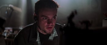 Movie still from “The Score” (2001), directed by Frank Oz – A person wearing a headset; Close Up shot, Low angle