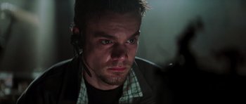 Movie still from “The Score” (2001), directed by Frank Oz – A person wearing a headset; Close Up shot, Low angle