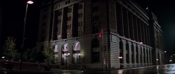 Movie still from “The Score” (2001), directed by Frank Oz – A building with a flag on the front of the building; Extreme Wide shot, Low angle
