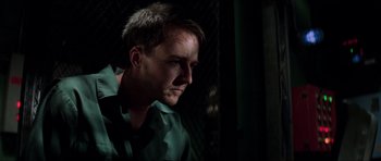 Movie still from “The Score” (2001), directed by Frank Oz – A person wearing a green shirt; Close Up shot, Low angle