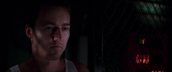 Movie still from “The Score” (2001), directed by Frank Oz – A person in a dark room; Close Up shot, Low angle