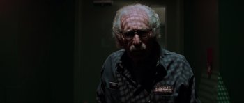 Movie still from “The Score” (2001), directed by Frank Oz – An older man with a beard and glasses; Close Up shot, Low angle