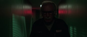 Movie still from “The Score” (2001), directed by Frank Oz – An old man with glasses and a beard in a dark room; Close Up shot, Low angle