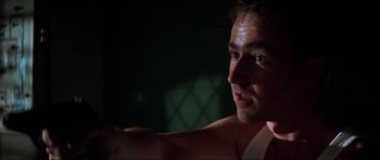 Movie still from “The Score” (2001), directed by Frank Oz – A man's face in the dark; Close Up shot, Low angle