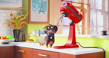 Movie still from “The Secret Life of Pets” (2016), directed by Chris Renaud – A dog standing next to an electric mixer on top of a counter; Wide shot, High angle