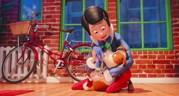 Movie still from “The Secret Life of Pets” (2016), directed by Chris Renaud – A woman is sitting on the floor holding a stuffed animal; Wide shot, Over the shoulder angle