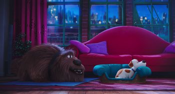 Movie still from “The Secret Life of Pets” (2016), directed by Chris Renaud – A dog laying on the ground next to a dog bed; Wide shot, Over the shoulder angle