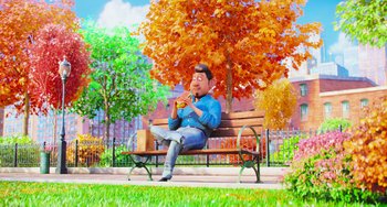 Movie still from “The Secret Life of Pets” (2016), directed by Chris Renaud – A man sitting on top of a wooden park bench; Wide shot, High angle